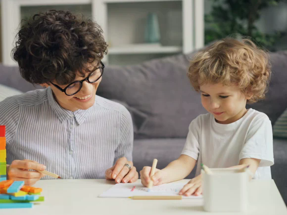 teacher and child writing image